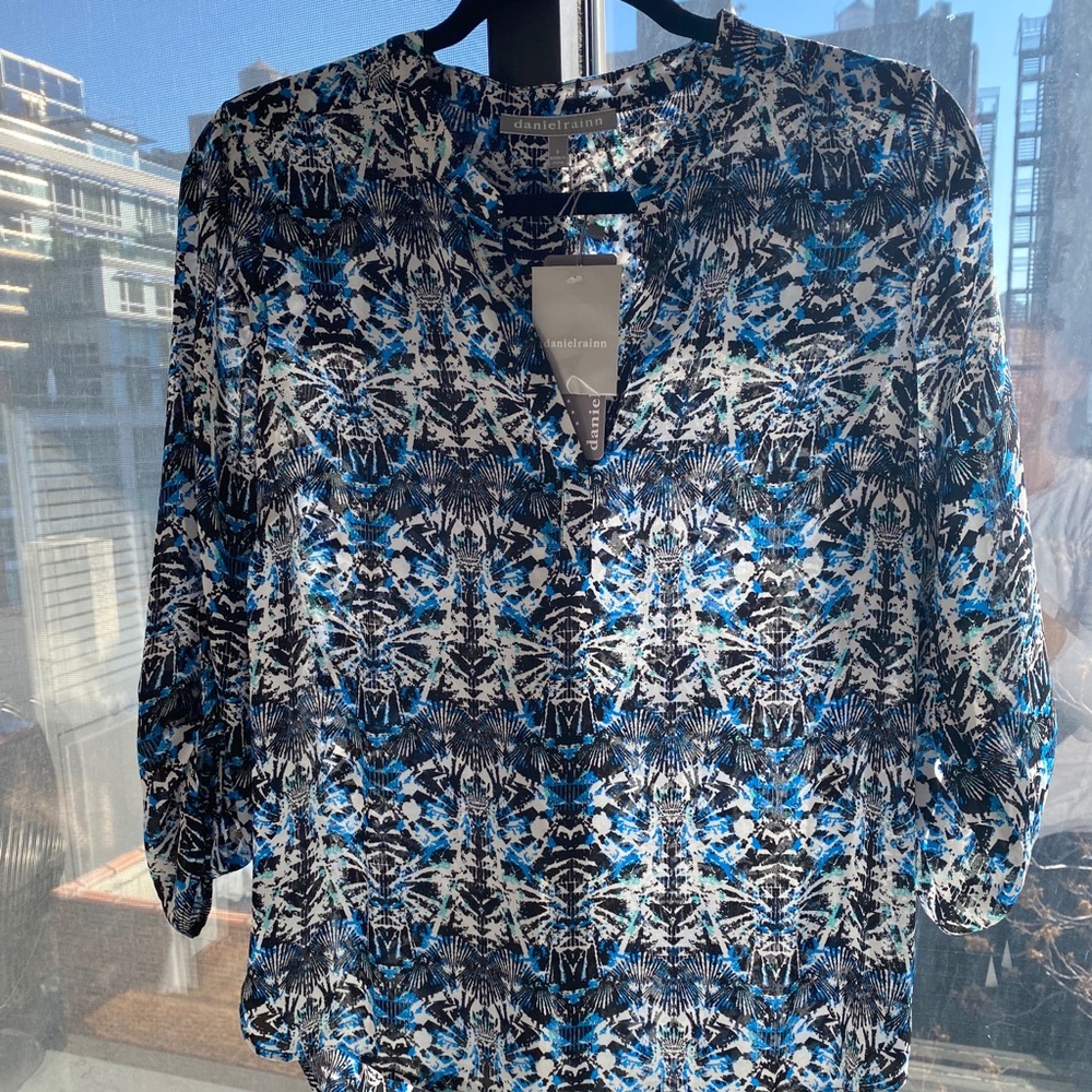 Never worn daniel rain top!
